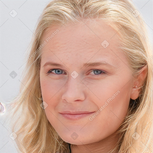 Joyful white young-adult female with long  brown hair and blue eyes