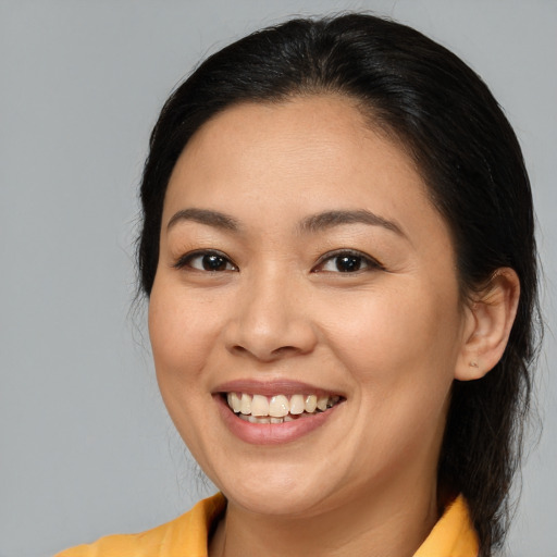 Joyful white young-adult female with medium  brown hair and brown eyes