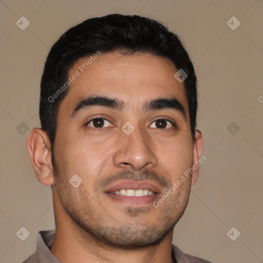 Joyful latino young-adult male with short  brown hair and brown eyes