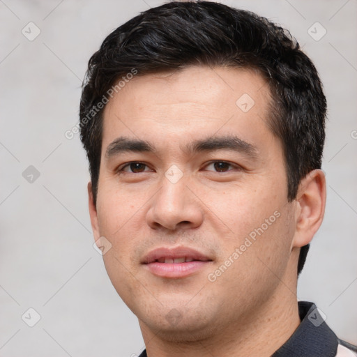 Joyful white young-adult male with short  black hair and brown eyes