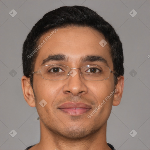 Joyful latino young-adult male with short  brown hair and brown eyes