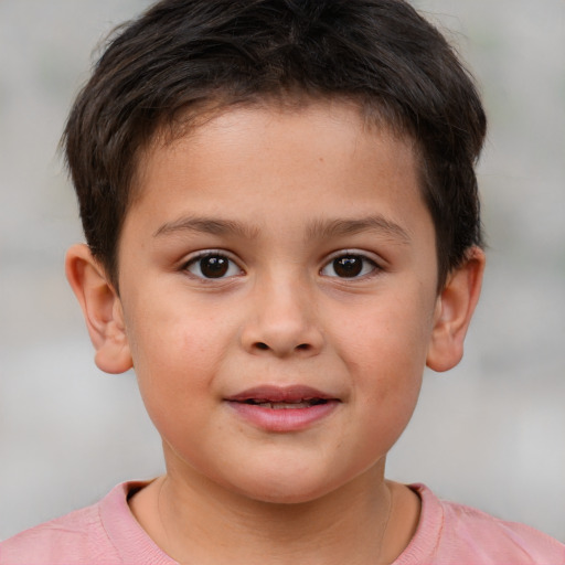 Joyful white child male with short  brown hair and brown eyes