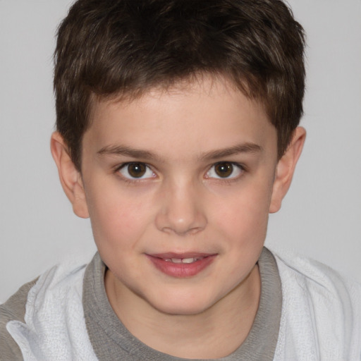 Joyful white child male with short  brown hair and brown eyes