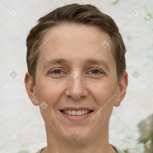 Joyful white adult male with short  brown hair and grey eyes