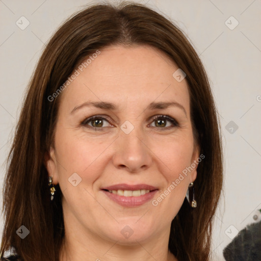 Joyful white adult female with long  brown hair and brown eyes