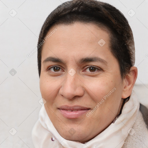 Joyful white adult female with short  brown hair and brown eyes