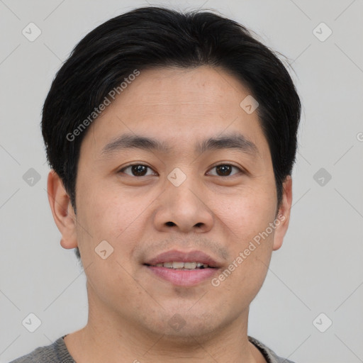 Joyful asian young-adult male with short  brown hair and brown eyes