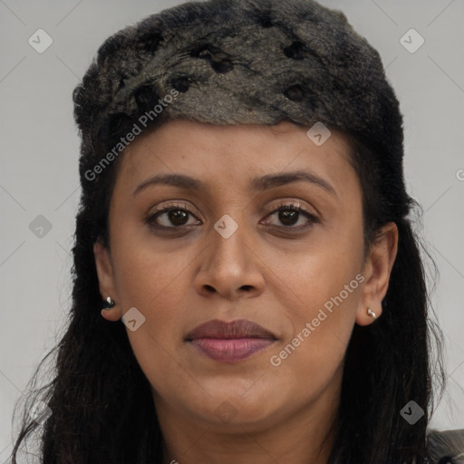 Joyful black young-adult female with long  brown hair and brown eyes