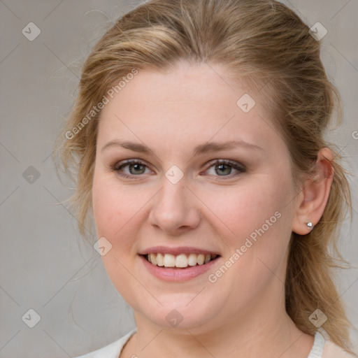 Joyful white young-adult female with medium  brown hair and blue eyes