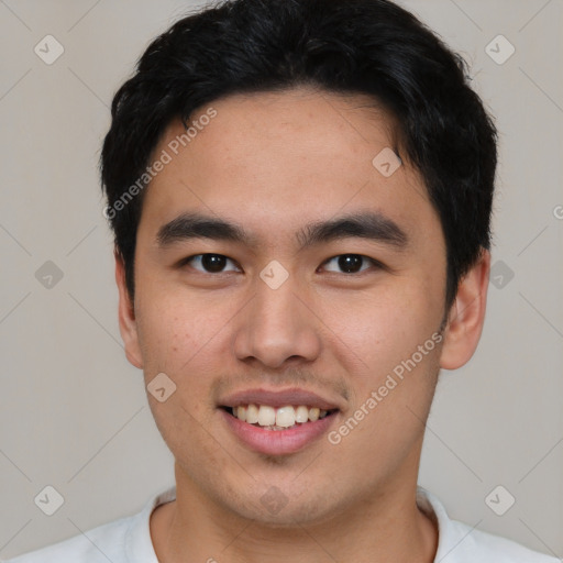 Joyful asian young-adult male with short  black hair and brown eyes