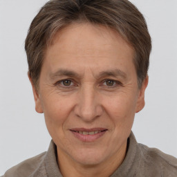 Joyful white adult female with short  brown hair and brown eyes