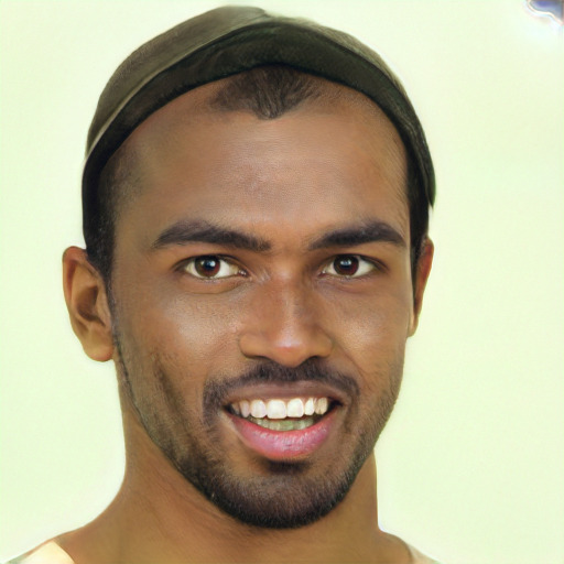 Joyful black young-adult male with short  brown hair and brown eyes