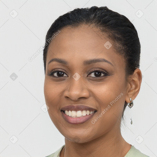 Joyful latino young-adult female with long  brown hair and brown eyes