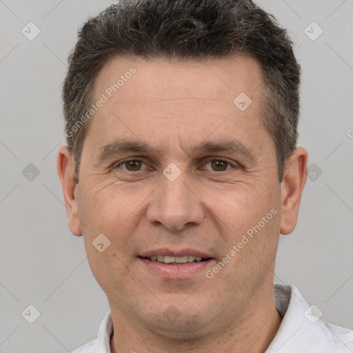 Joyful white adult male with short  brown hair and brown eyes