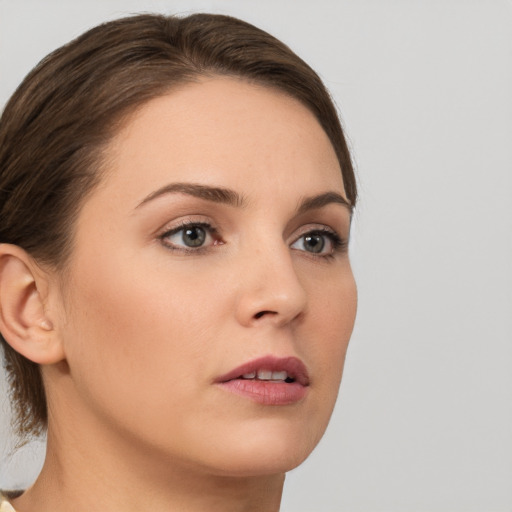 Neutral white young-adult female with medium  brown hair and brown eyes