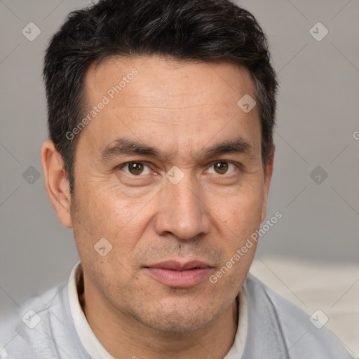 Joyful white adult male with short  brown hair and brown eyes