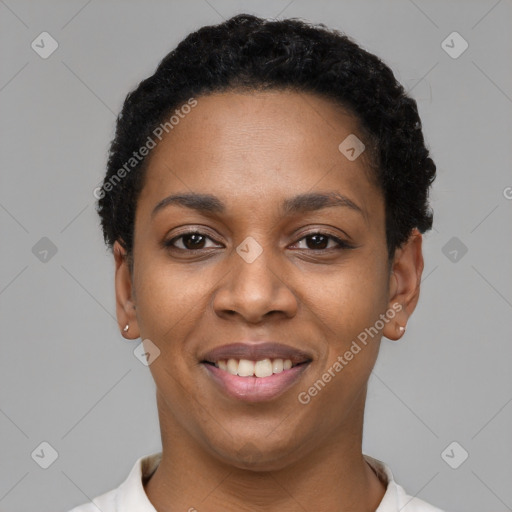 Joyful black young-adult female with short  black hair and brown eyes