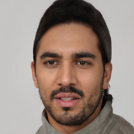 Neutral latino young-adult male with short  black hair and brown eyes
