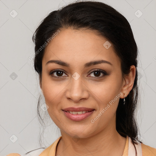 Joyful latino young-adult female with medium  brown hair and brown eyes