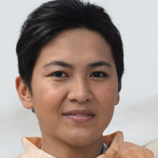 Joyful asian young-adult female with short  brown hair and brown eyes