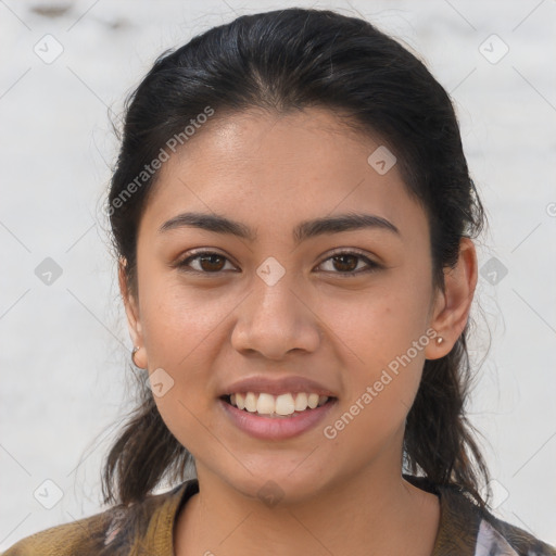 Joyful latino young-adult female with medium  brown hair and brown eyes