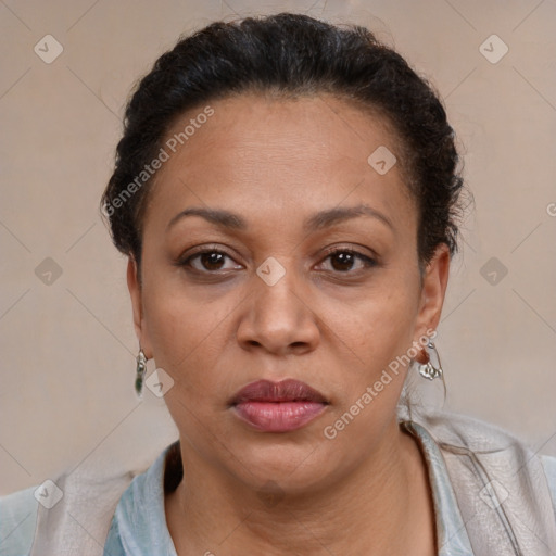 Joyful latino adult female with short  brown hair and brown eyes