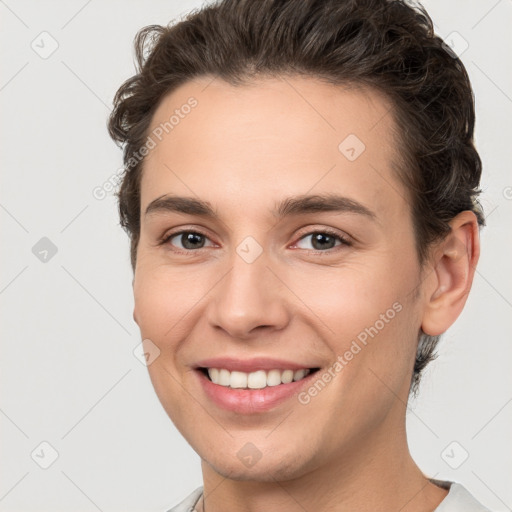 Joyful white young-adult female with short  brown hair and brown eyes