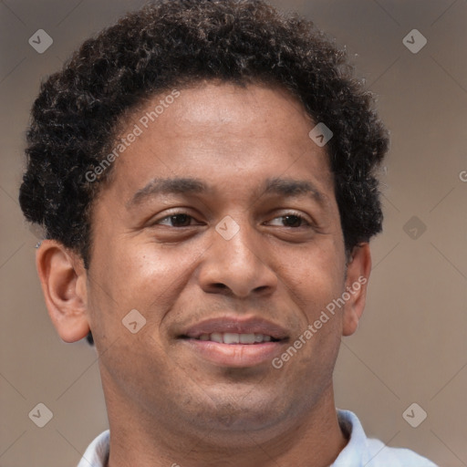 Joyful black adult male with short  brown hair and brown eyes