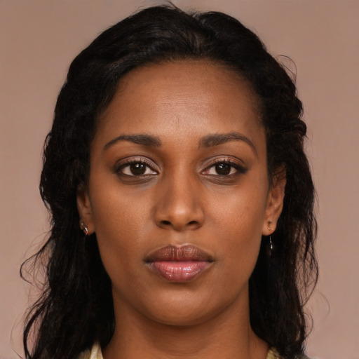 Neutral black young-adult female with long  brown hair and brown eyes