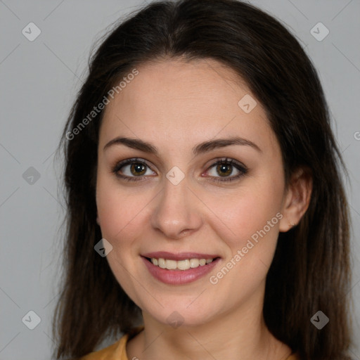 Joyful white young-adult female with long  brown hair and brown eyes