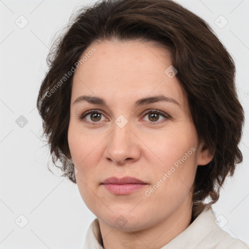 Joyful white adult female with medium  brown hair and brown eyes