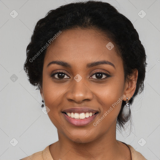 Joyful black young-adult female with long  black hair and brown eyes