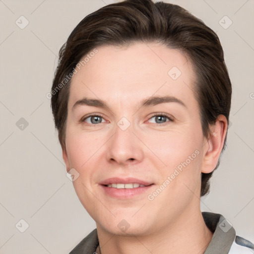 Joyful white young-adult female with short  brown hair and grey eyes