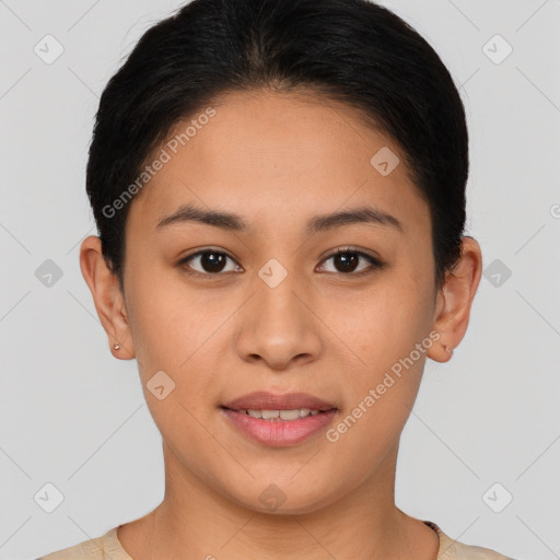 Joyful latino young-adult female with short  brown hair and brown eyes