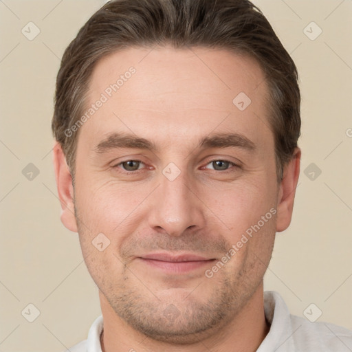 Joyful white adult male with short  brown hair and brown eyes