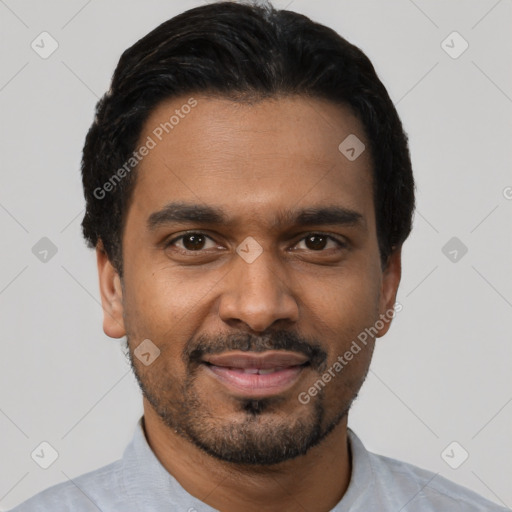 Joyful black young-adult male with short  black hair and brown eyes