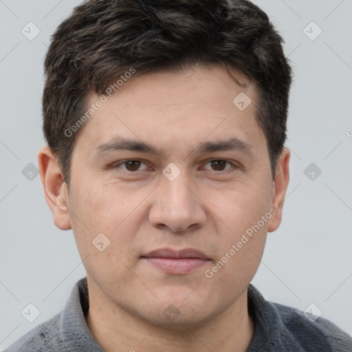 Joyful white adult male with short  brown hair and grey eyes