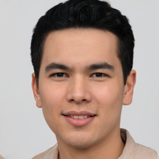 Joyful asian young-adult male with short  black hair and brown eyes