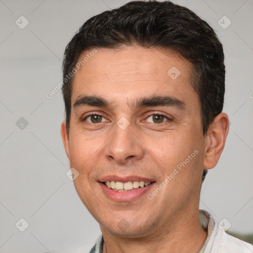 Joyful white adult male with short  brown hair and brown eyes