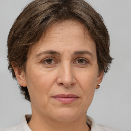 Joyful white adult female with short  brown hair and brown eyes