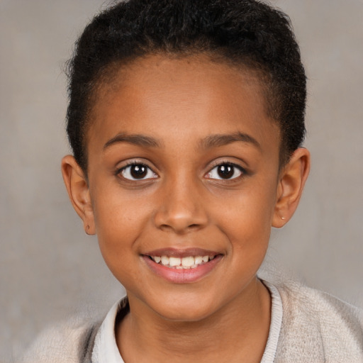Joyful black child female with short  brown hair and brown eyes