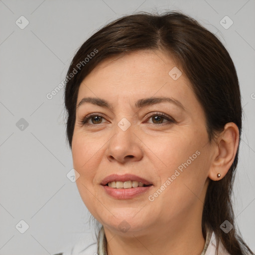 Joyful white young-adult female with medium  brown hair and brown eyes