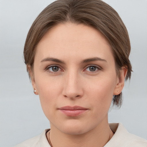 Neutral white young-adult female with short  brown hair and grey eyes