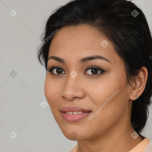 Joyful latino young-adult female with medium  brown hair and brown eyes