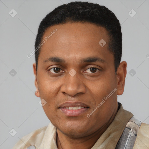 Joyful latino young-adult male with short  black hair and brown eyes