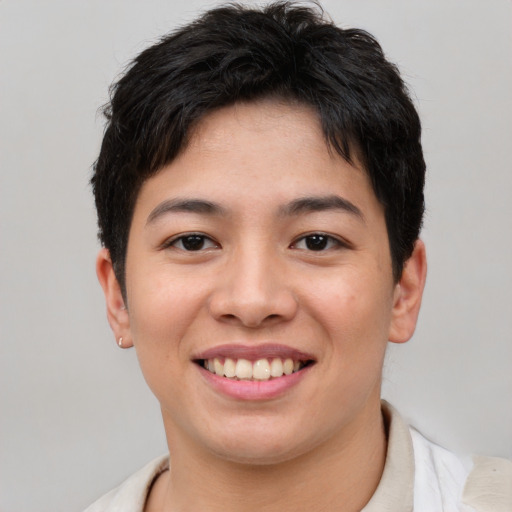Joyful asian young-adult female with short  brown hair and brown eyes