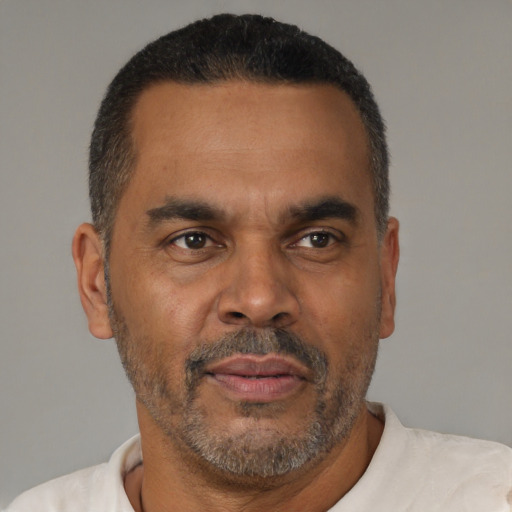 Neutral latino adult male with short  black hair and brown eyes