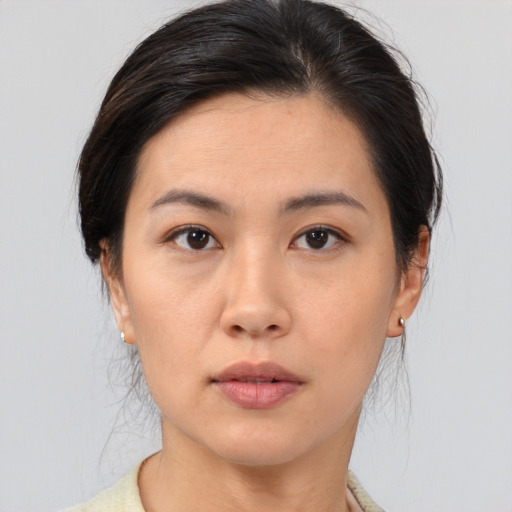 Neutral asian young-adult female with medium  brown hair and brown eyes