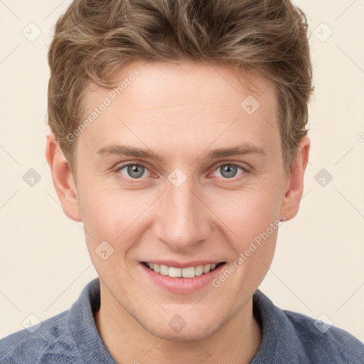 Joyful white young-adult male with short  brown hair and blue eyes