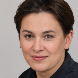 Joyful white adult female with short  brown hair and brown eyes